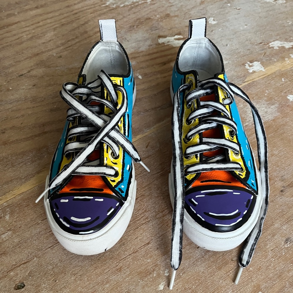 Custom painted colorful cartoon inspired lace up sneakers.